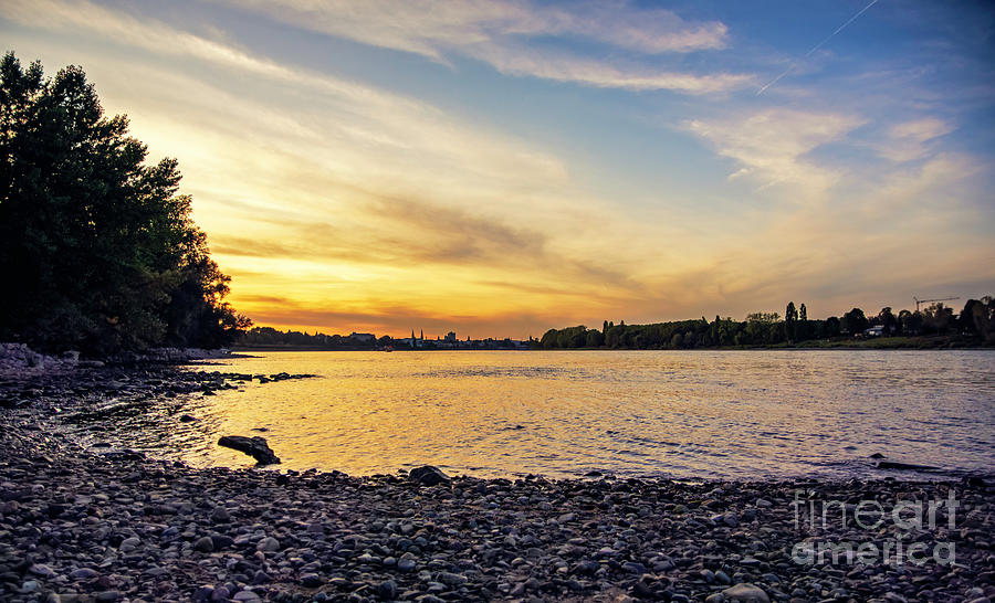 Orange sunset by the Rheine riverside  Photograph by Mendelex Photography