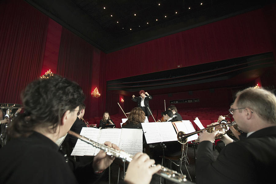 Orchestra Performing in a Theatre Photograph by Digital Vision.