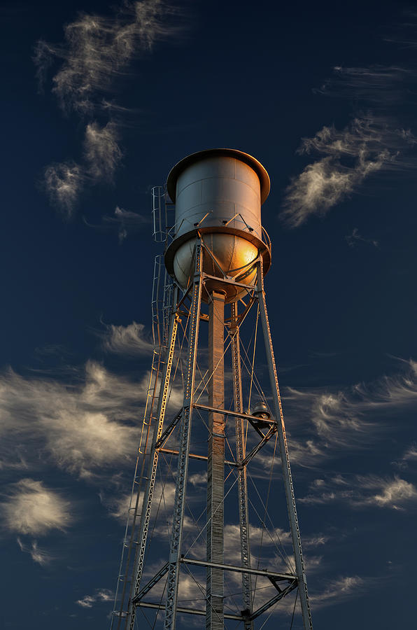 Oregon WI Tin-Man Water Tower glowing in setting sunlight - vertical format option Photograph by Peter Herman