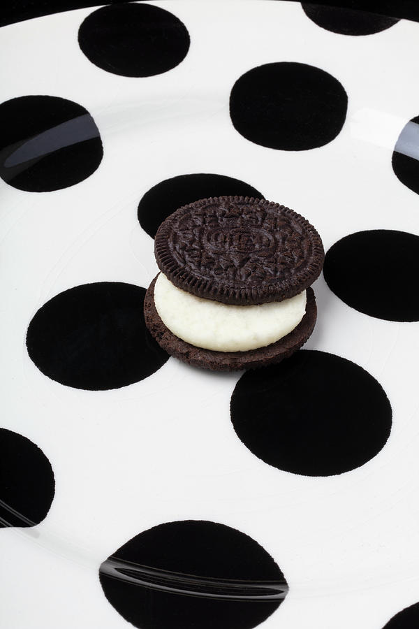 Cookie Photograph - Oreo Cookie On Plate With Black Spots by Garry Gay