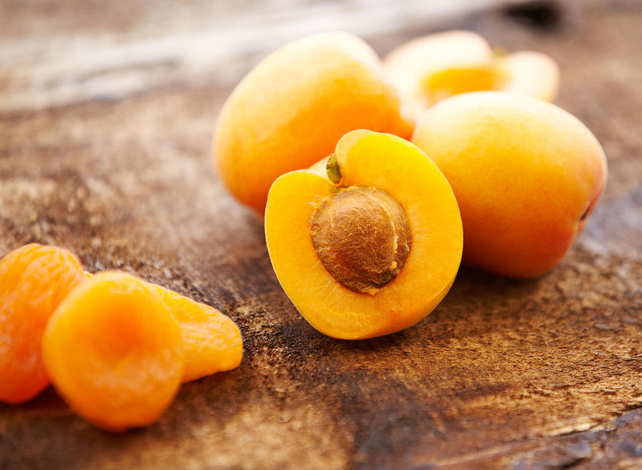 Organic fresh and dried apricots Photograph by GSPictures
