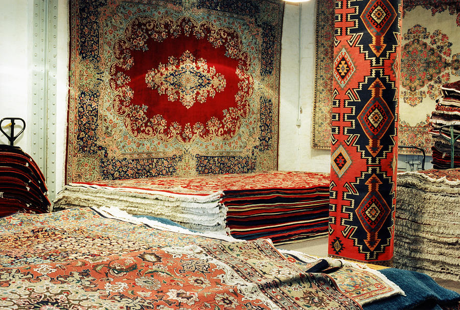 Oriental carpets in a shop Photograph by Gregor Hohenberg