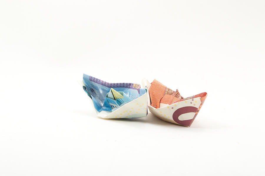 Origami boats made with Euro banknotes Photograph by Luis Diaz Devesa