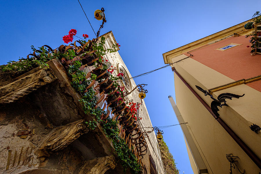 Ornaments, decorations and flowers on buildings in Taormina, Sicily, Italy Photograph by Finn Bjurvoll Hansen