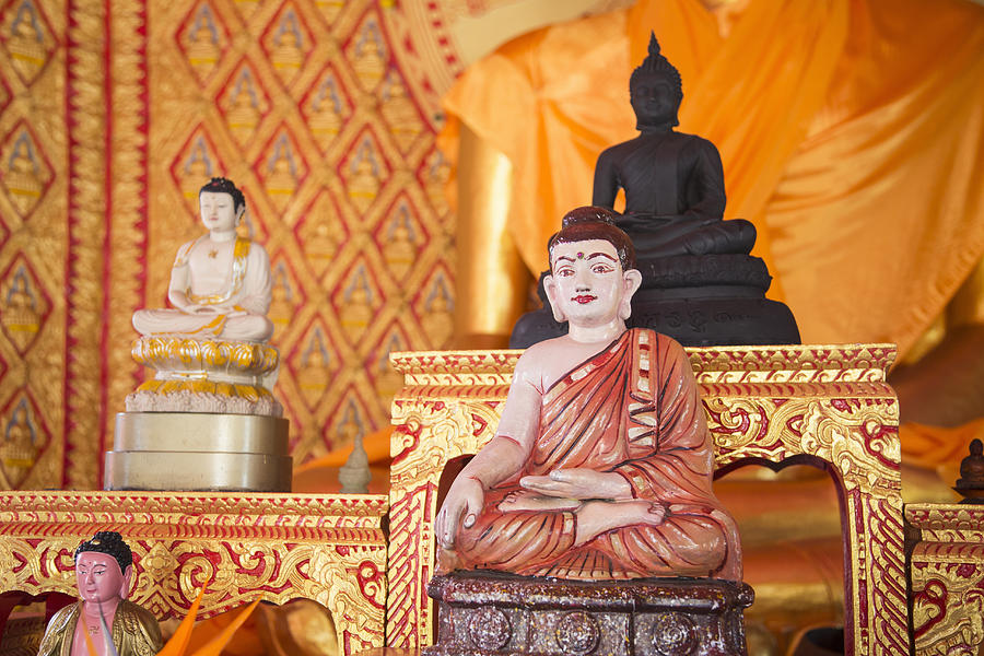 Ornate Buddha statues in temple Photograph by Inti St Clair