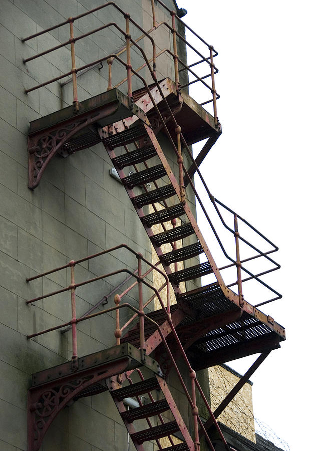 Ornate red fire escape Photograph by Lyn Holly Coorg