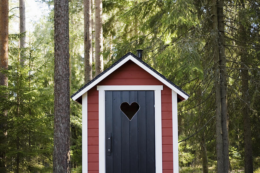 Outhouse in forest Photograph by Tiina & Geir