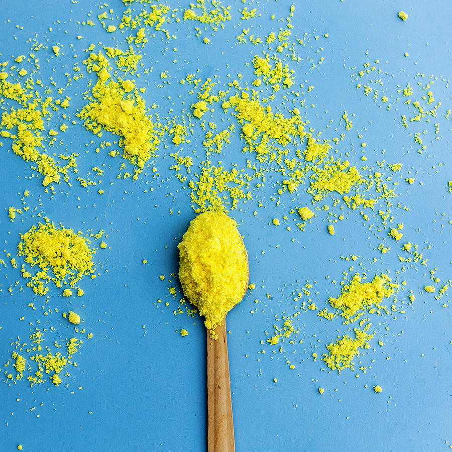 Overhead Shot Of Spoon With Yellow Flour Photograph by Carol Yepes