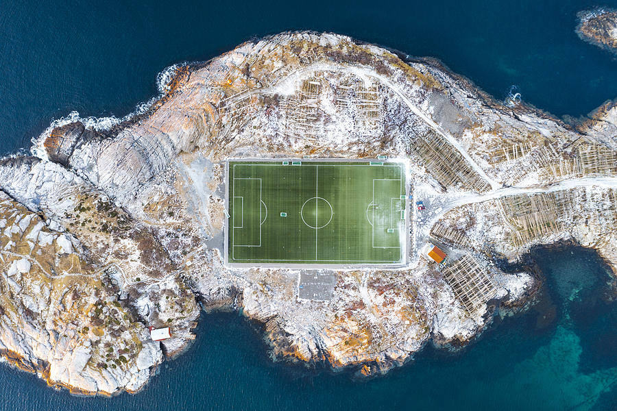 Overhead view of a football field surrounded by snow in Norway Photograph by © Marco Bottigelli