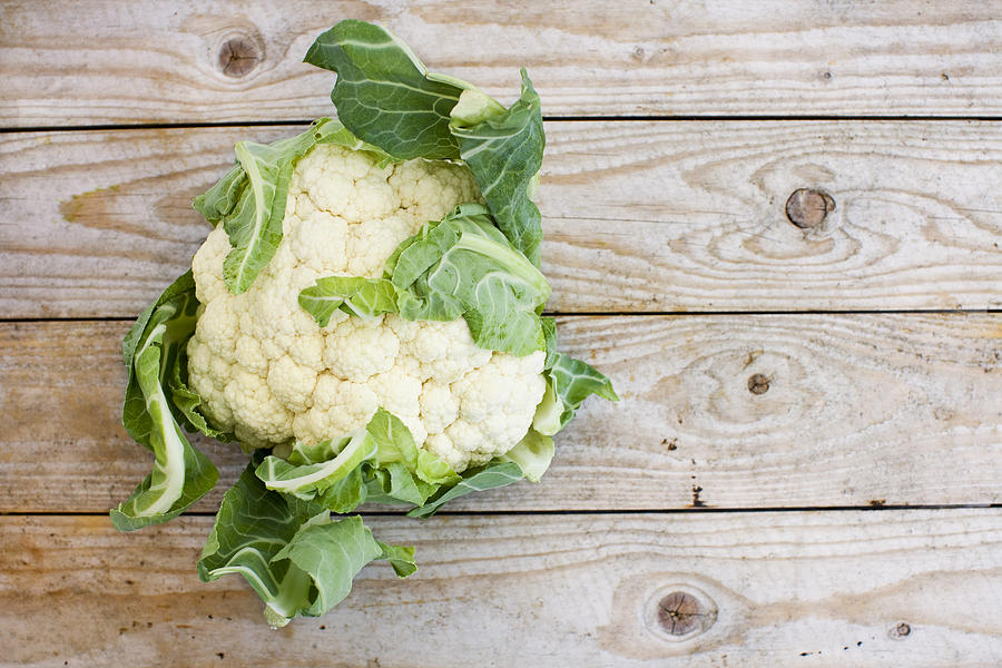 Overhead view of cauliflower on wooden table Photograph by Fridholm, Jakob