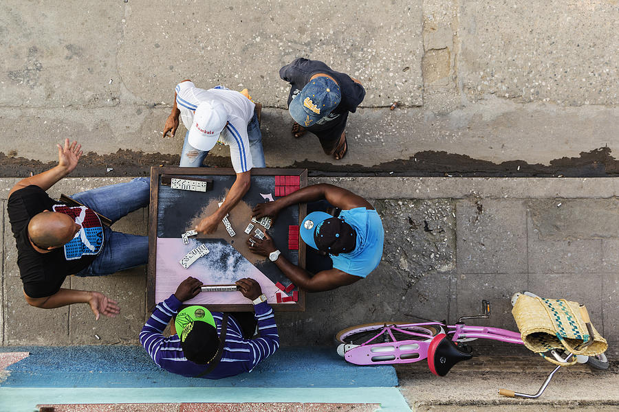 Overhead view of men playing dominoes on Camaguey street, Camaguey, Cuba Photograph by Jeremy Woodhouse