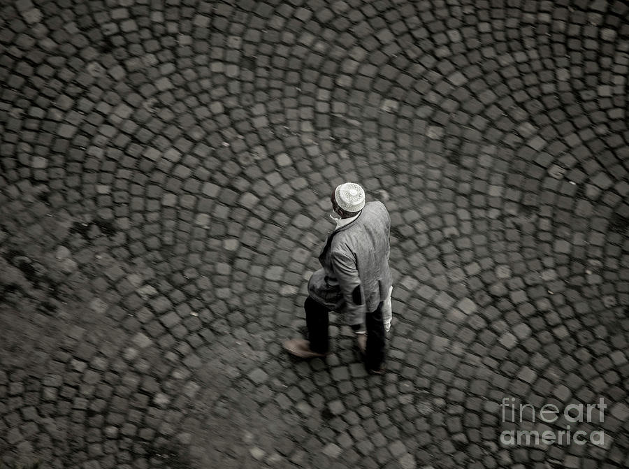 Overhead View Of Muslim Man With Kufi Walking On Street Photograph