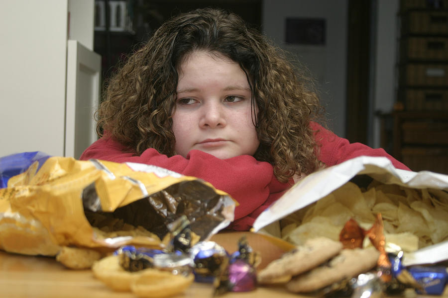 Overweight Child with Junk Food Photograph by StaffordStudios