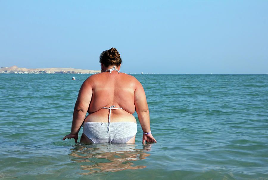 Overweight Woman Bath In Sea Photograph by Mikhail Kokhanchikov