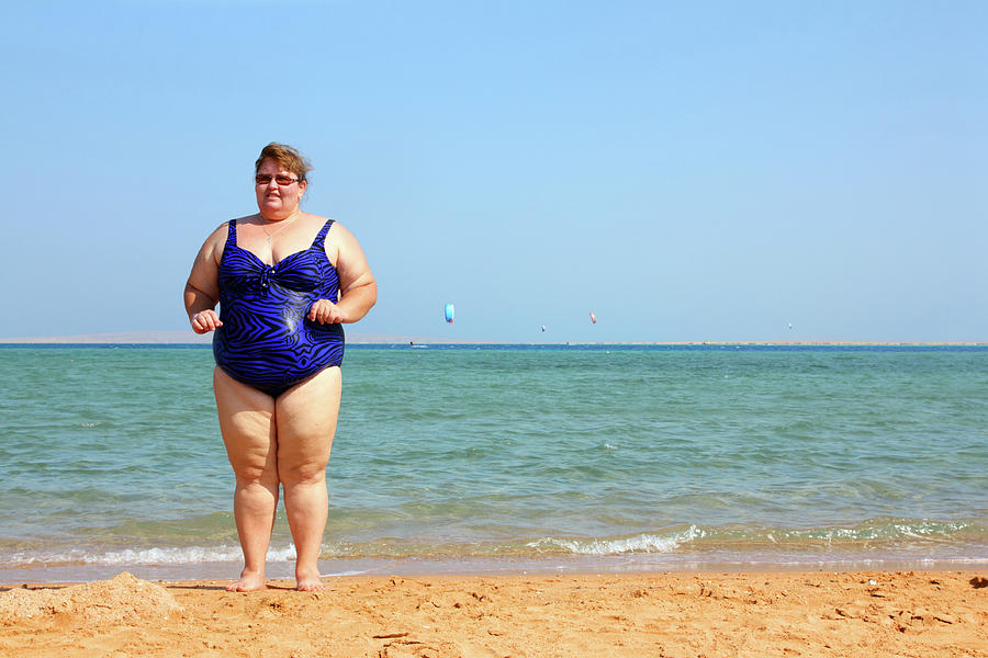 Overweight Woman On Beach Photograph by Mikhail Kokhanchikov