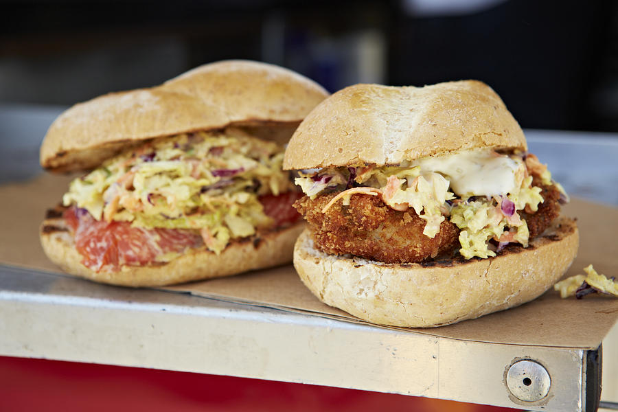 Oyster Po Boy and wild salmon filet burger on food truck Photograph by Tracey Kusiewicz/Foodie Photography