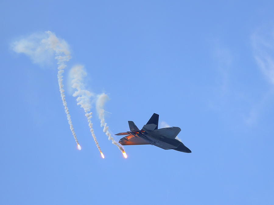 F22 Raptor firing off flares Photograph by Alex Nikitsin - Fine Art America