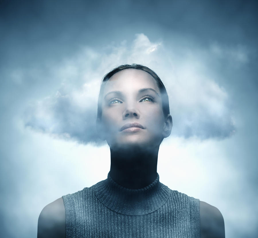 Pacific Islander woman with her head in the clouds Photograph by Colin Anderson Productions pty ltd