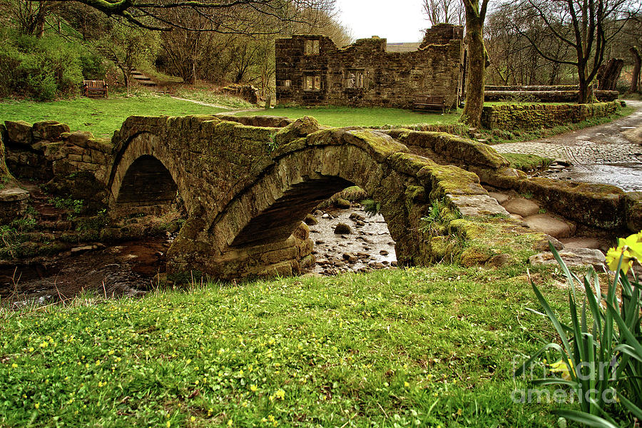Packhorse bridge and hall ruins at Wycoller, Lancashire. Photograph by David Birchall