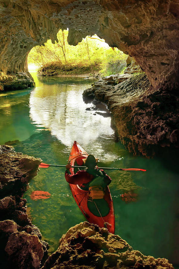 paddling in Cave Spring Photograph by Robert Charity