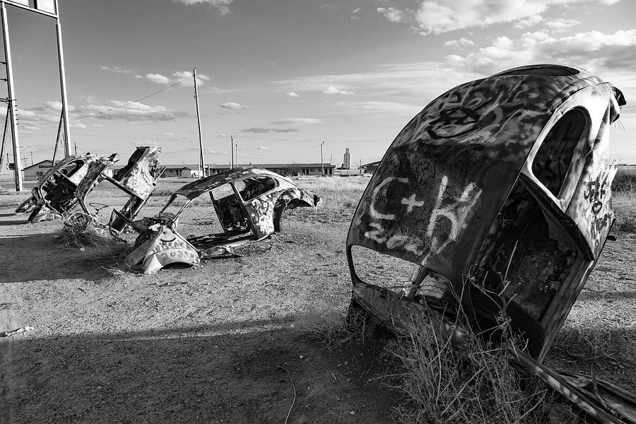 Painted abandoned cars on Historic Route 66 in black and white Photograph by Eldon McGraw