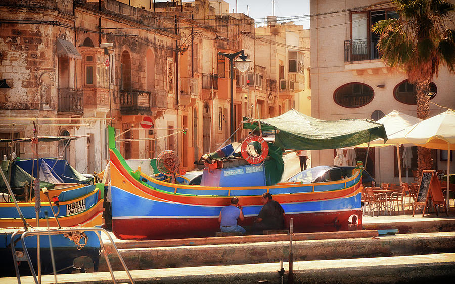 Painting a Maltese Luzzu in Summer - Street photo in Malta Photograph by Stephan Grixti