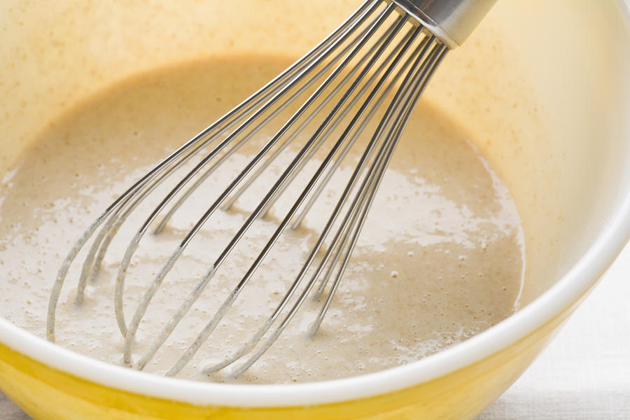 Pancake batter and whisk in mixing bowl Photograph by Kristin Lee