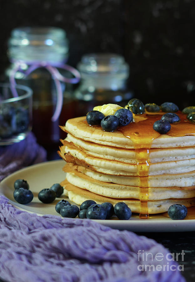 Blueberry Photograph - Pancake stack served with blueberries and honey. by Milleflore Images