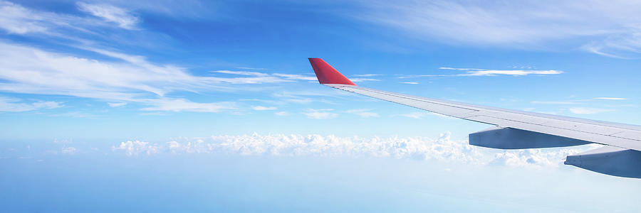 Panorama of plane wing above nice blue sky Photograph by Maria Kray