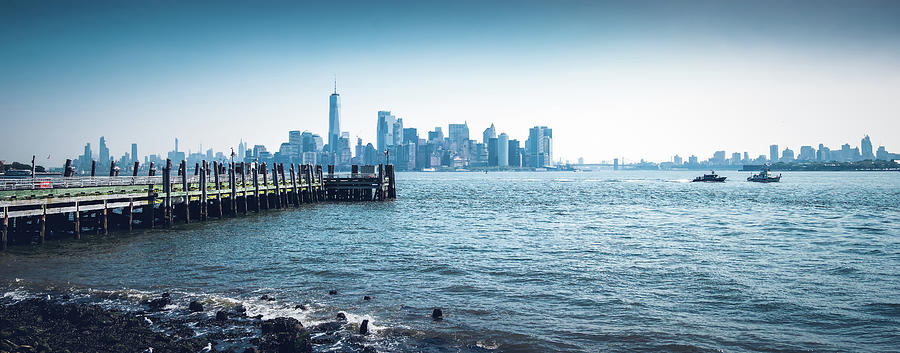 Panorama of the Hudson River over Manhattan skyline with pier in the foreground. Photograph by Jean-Luc Farges