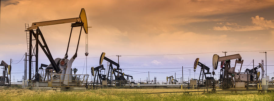 Panoramic pumpjack lifts oil from a well in California Photograph by Pgiam
