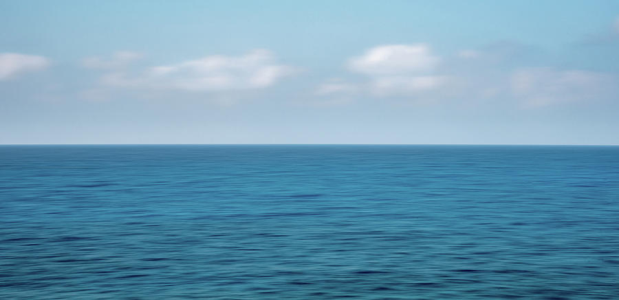 Panoramic seascape with clouds on the horizon. Photograph by Michalakis Ppalis