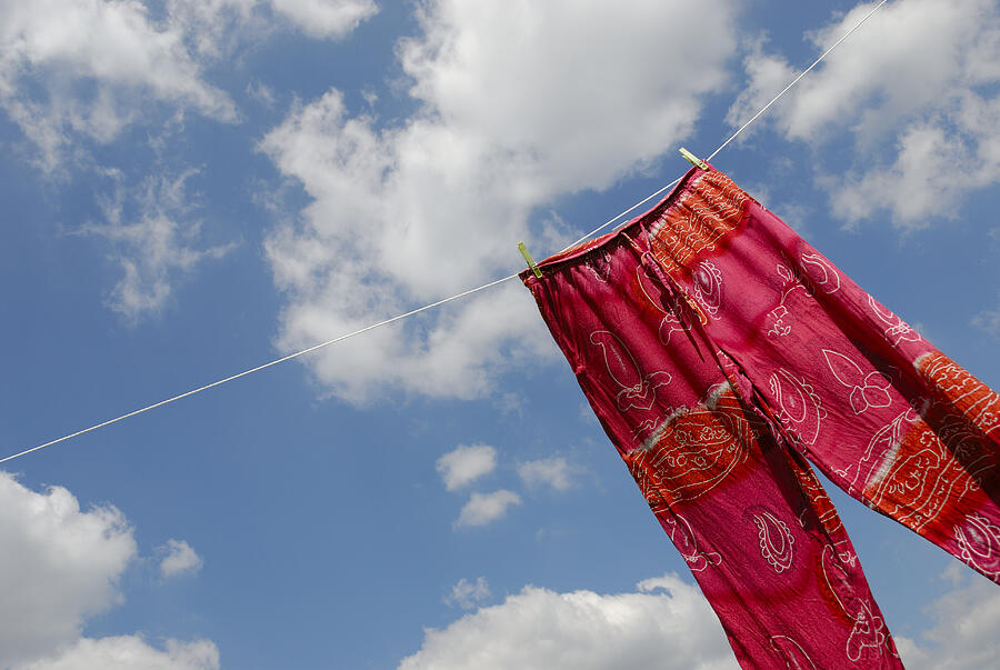 Pant hanging on washing line, low angle view Photograph by Sami Sarkis