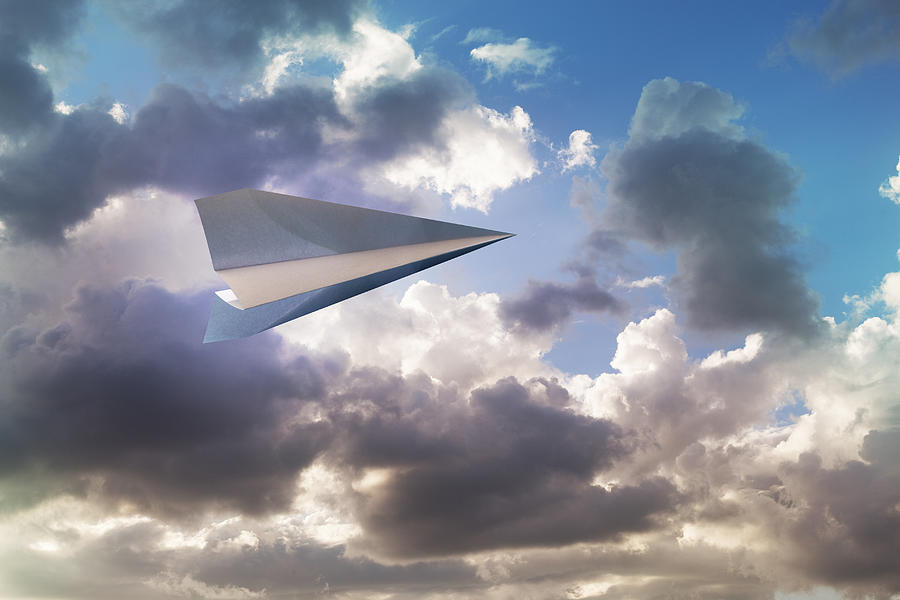 Paper airplane flying in the sky Photograph by Hiroshi Watanabe