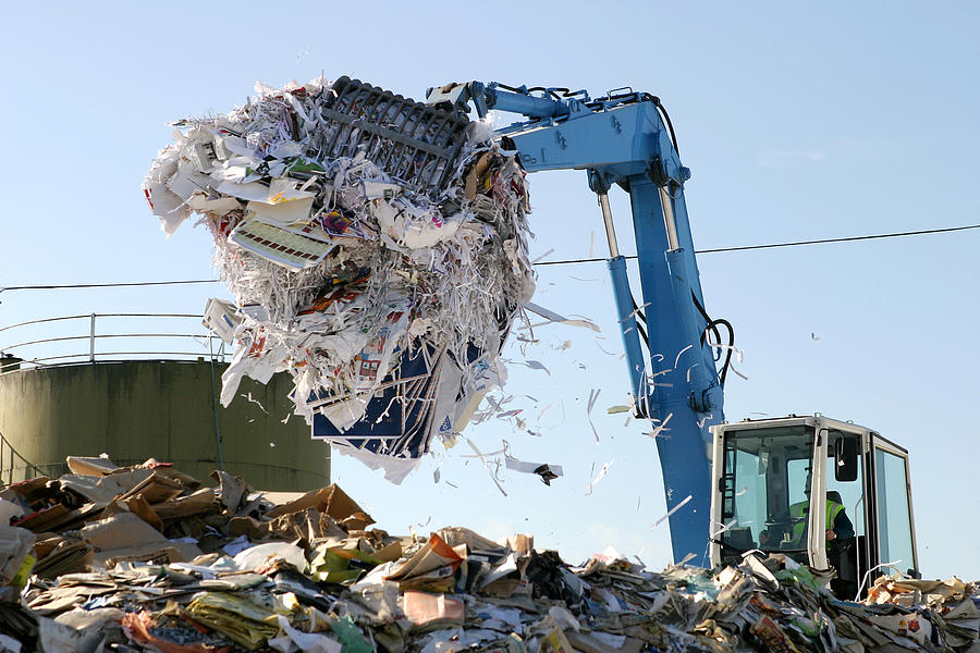 Paper being recycled at waste collection plant Photograph by Marcus Clackson