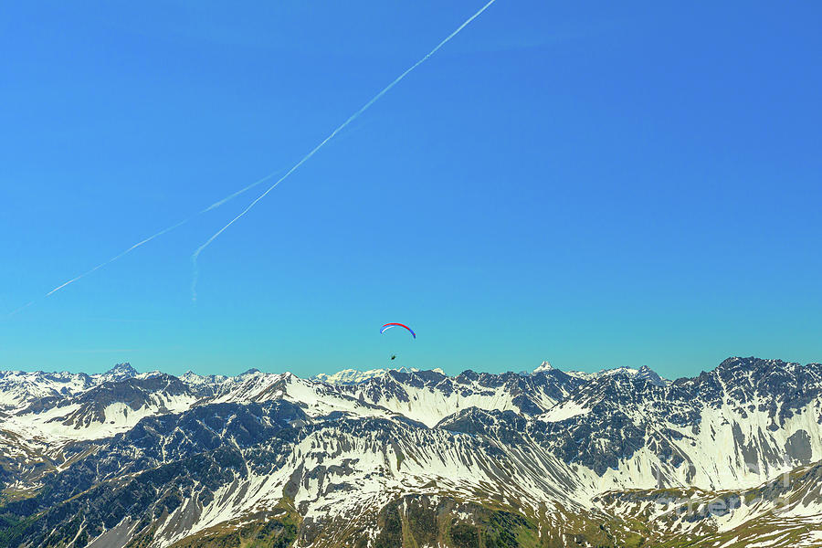 paragliding on Aroser Weisshorn peak Photograph by Benny Marty