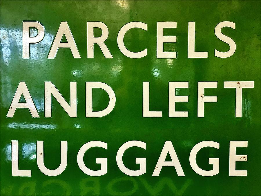 Parcels and Left Luggage Sign Photograph by Gordon James