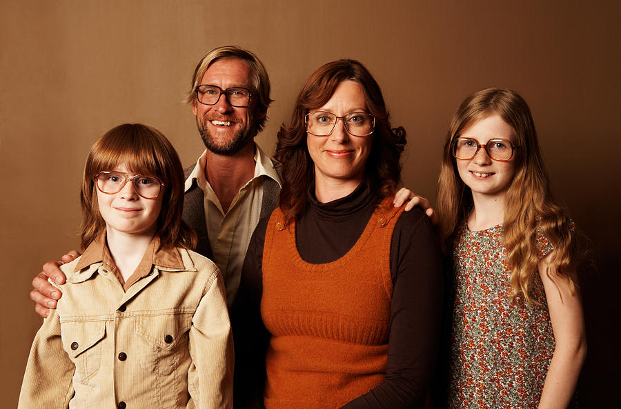 Parents and two children (9-11) wearing spectacles, smiling, portrait Photograph by Justin Geoffrey