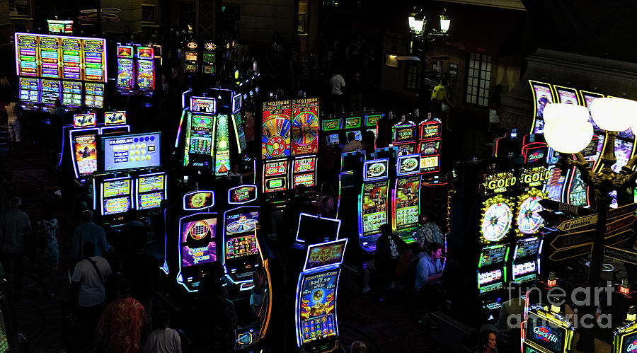 Paris Las Vegas Hotel and Casino Gambling with Slot Machines in Las Vegas Nevada Photograph by David Oppenheimer
