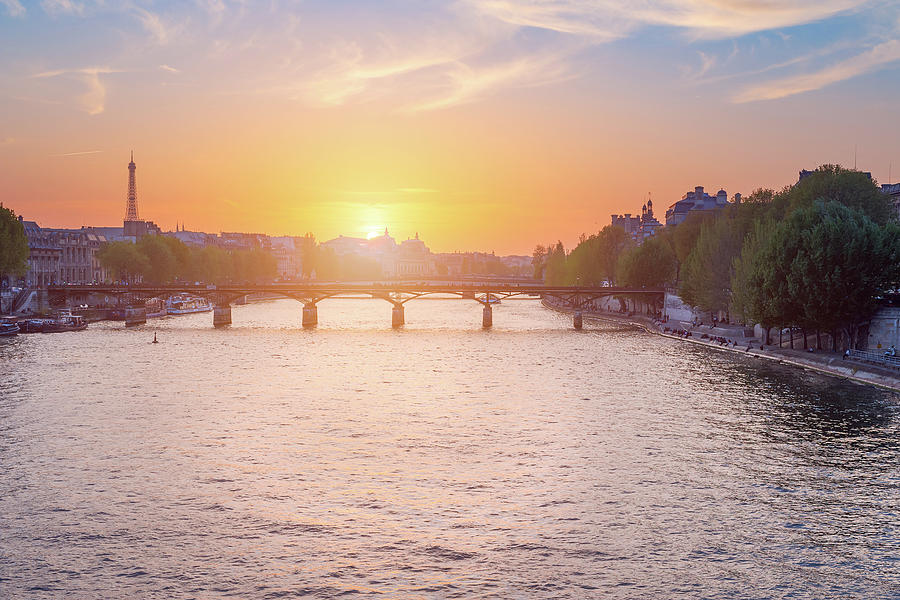 Paris skyline and river Seine at sunset Photograph by Philippe Lejeanvre