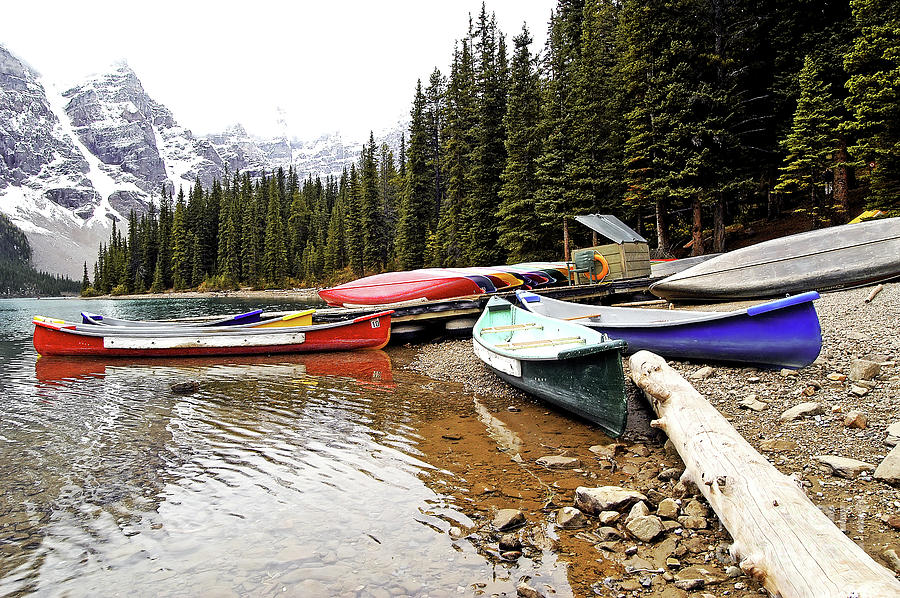 Parked Canoes - Morraine Lake - Banff National Park - Alberta - Canada  Photograph by Paolo Signorini