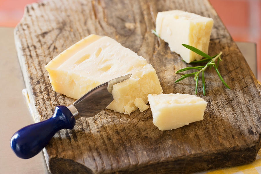 Parmesan and a cheese knife Photograph by Image Source