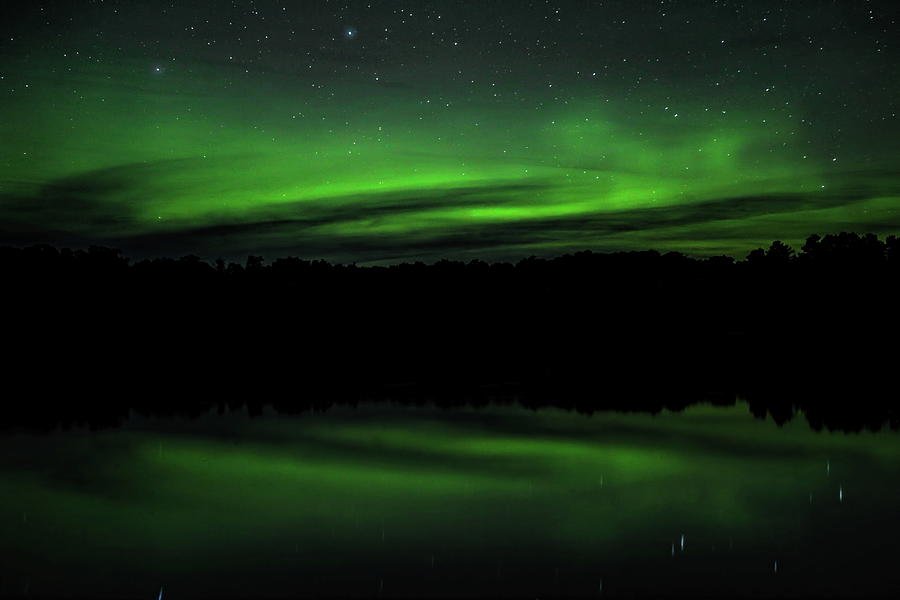 Partly Cloudy Aurora Over Carrol Lake Photograph by Dale Kauzlaric