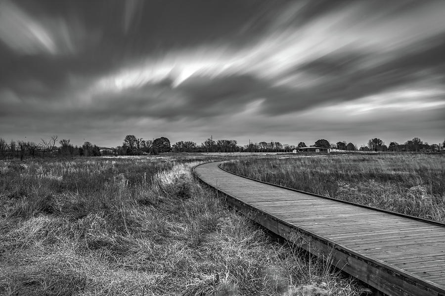 Passing Skies Over The Boardwalk - Black and White Photograph by Gregory Ballos