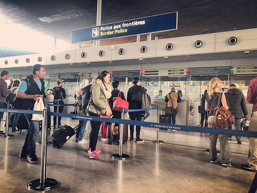 Passport control in Roissy Charles de Gaulle Airport, Paris, France Photograph by Anouchka