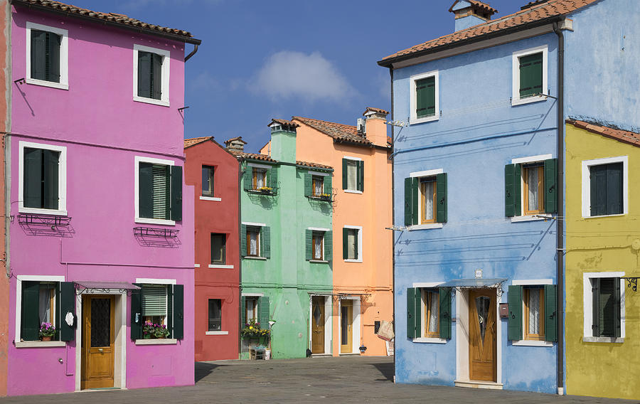 Pastel color houses over channel in Burano Photograph by Buena Vista Images