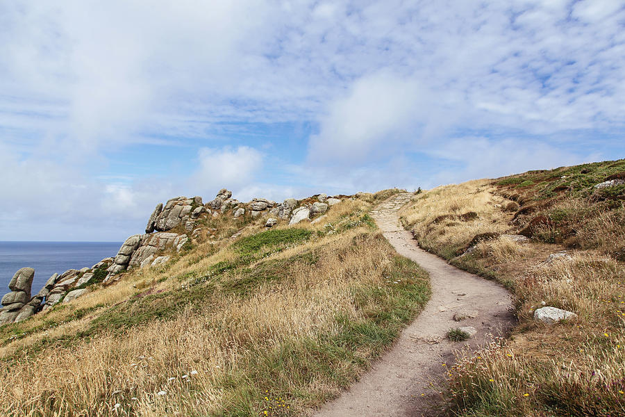 Pathway leading over hill along rugged coastline Photograph by Jodie Griggs