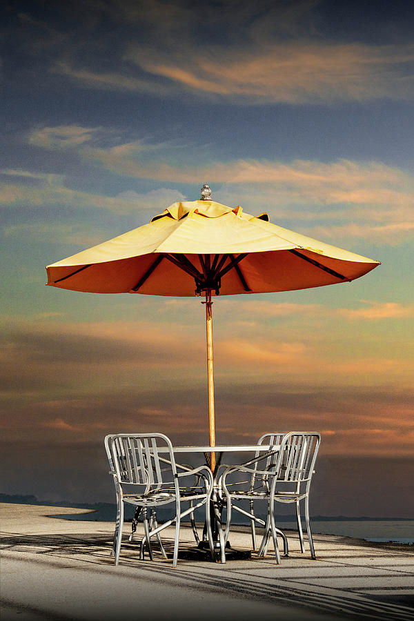 Patio Umbrella with Table and Chairs at Sunset Photograph by Randall Nyhof