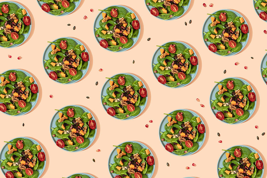 Pattern of plates of fresh ready-to-eat vegan salad Drawing by Westend61