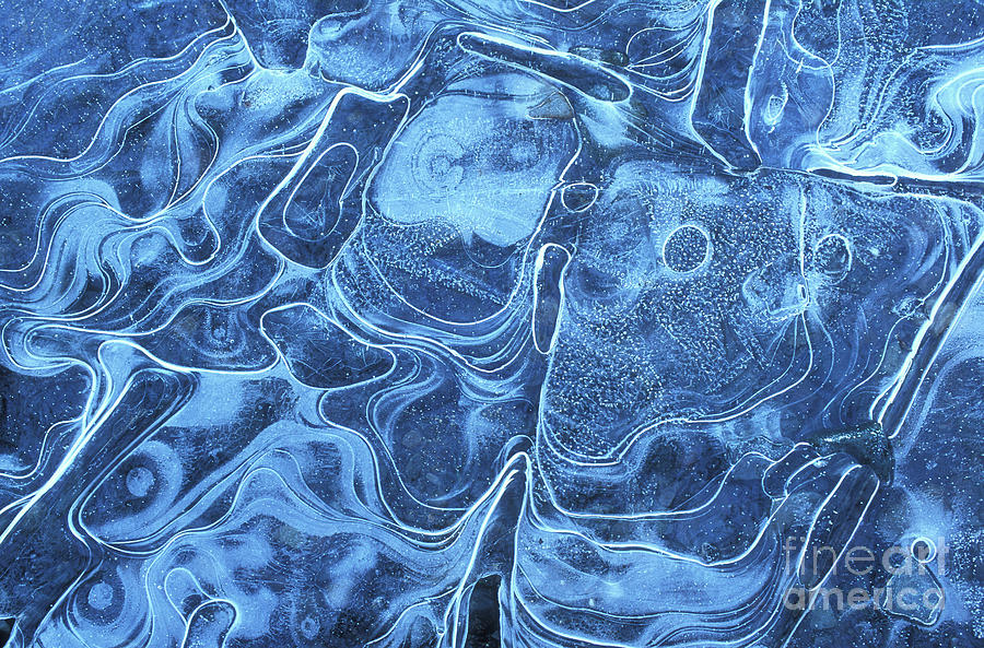 Patterns in the ice of a frozen lake Photograph by Neale And Judith Clark